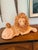 A magnificent signed 1970s reclining ceramic lion sculpture executed with exceptional craftsmanship and impressive scale....