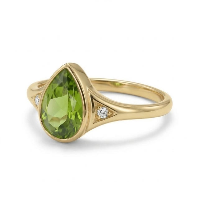 Pear-Cut Peridot Ring with Diamond Accents – August Birthstone This elegant ring showcases a vibrant peridot gemstone,...