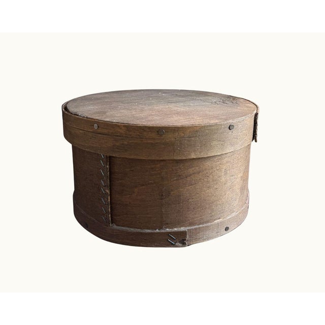Antique primitive bentwood cheese box with fitted lid, iron tack construction, and bentwood banding. Stamped on bottom:...