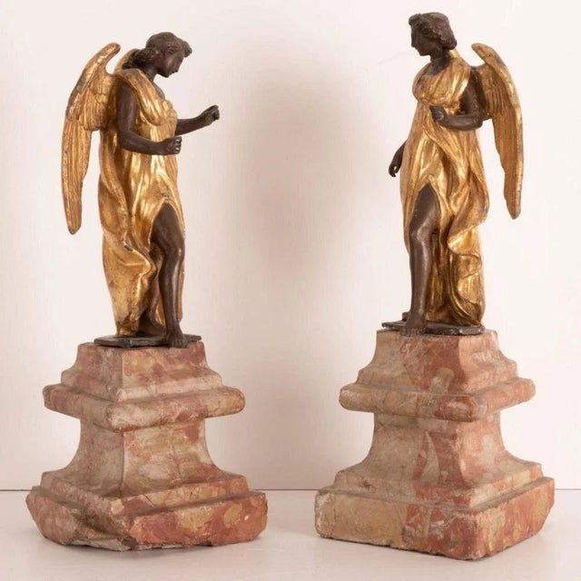 Roman manufacture of the 18th century. Pair of sculptures in burnished and gilded metal. Measures: Height 40 cm. Marble...