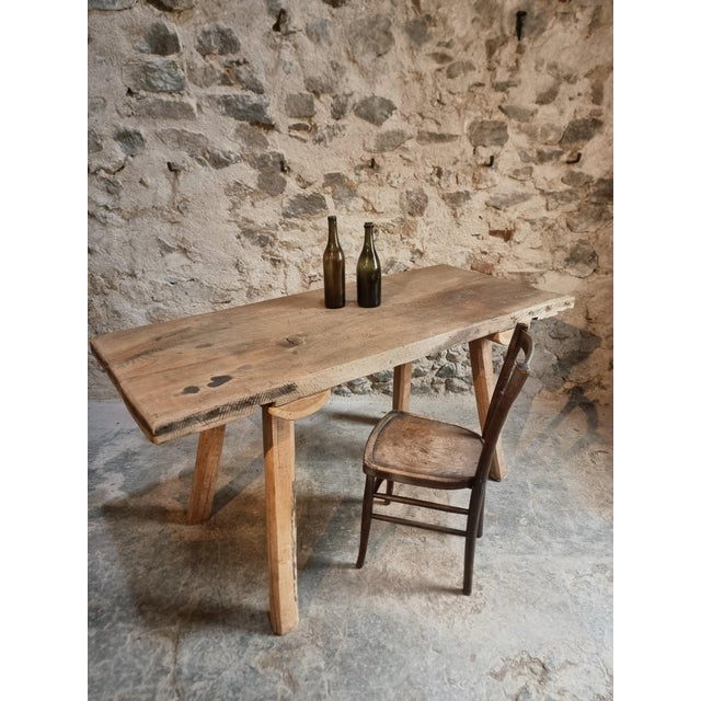 Rustic old table from Hungary, dating from approximately 1900–1930. with its primitive character, robust construction, and...