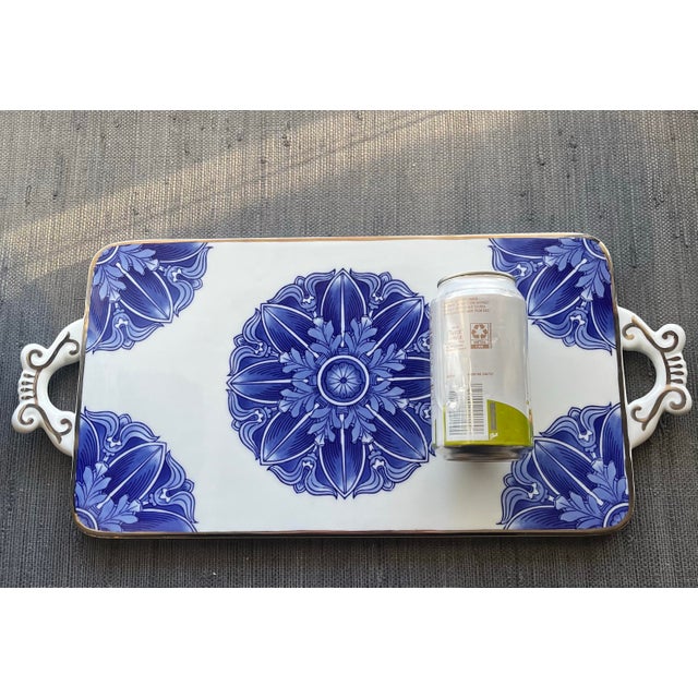 This vintage Bombay Company blue and white ceramic Chinoiserie serving platter (or tray) features elegant scrolled handles...
