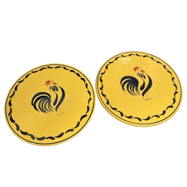 Bring rustic charm to your dining room or kitchen display with this vintage set of two round ceramic placemats. Crafted...