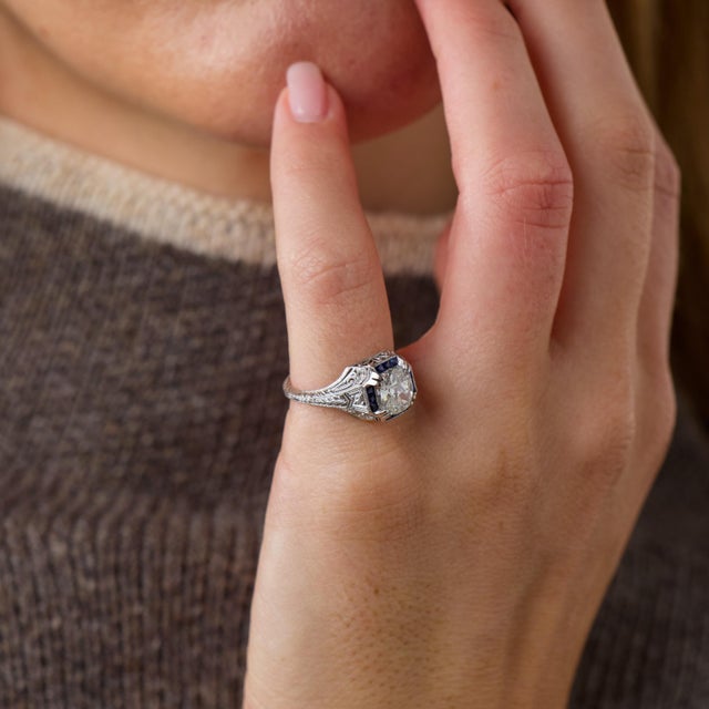 This exceptional Art Deco engagement ring is a beautifully detailed jewel from the 1920’s, centered by a GIA-certified...