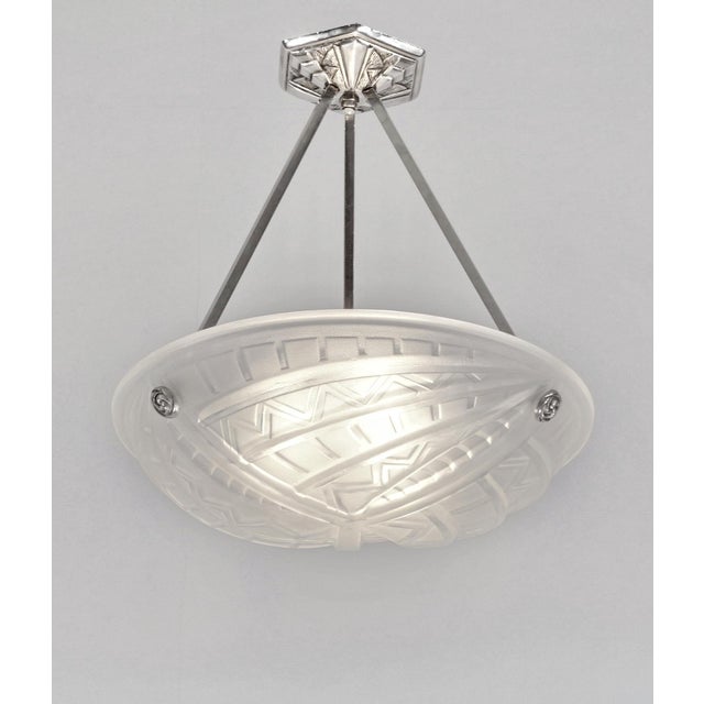 NOVERDY A beautiful French 1930 art deco pendant in nickel plated solid brass holding a bowl in clear frosted molded-...