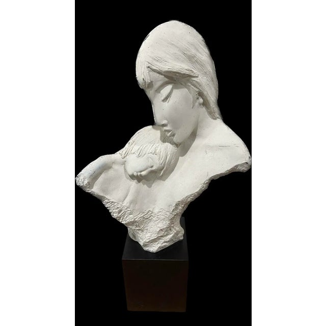 Mother and son ceramic sculpture by Austin Production inc. Sign 1984 On a wood pedestal.