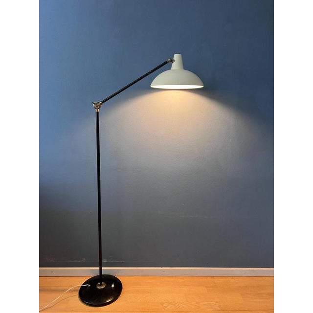 A beautiful vintage anvia floor lamp designed by dutch designer j.j.m. Hoogervorst. The lamp features a clean white metal...