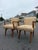 Pair of Jens Risom C-108 arm chairs. These chairs feature a sculpture carved wood armrests with an iconic mid century...