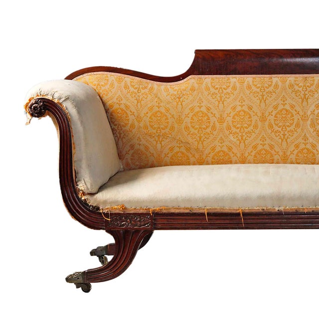 Antique 19th century fine classical American carved mahogany sofa. Solid mahogany with a dark wood finish and a shaped top...