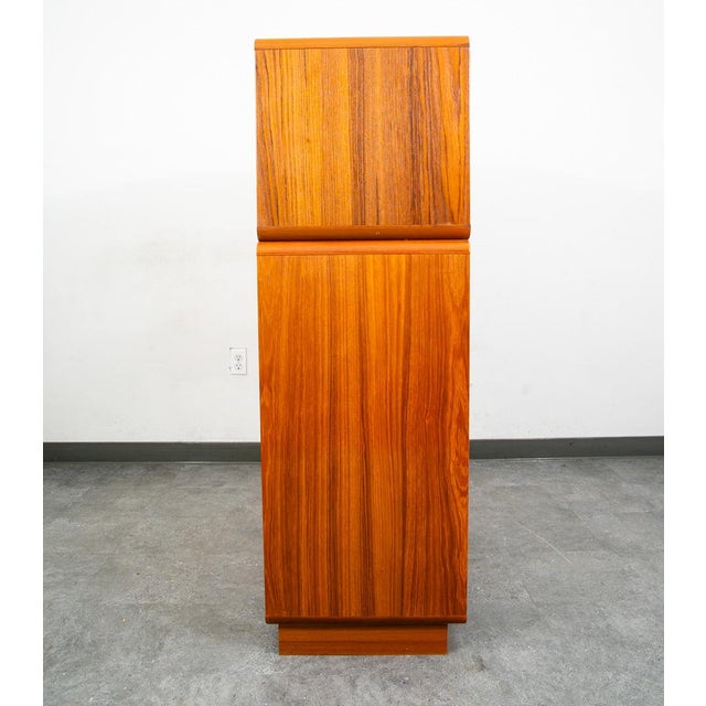 2 piece Danish teak bookshelf cabinet with 2 doors glass display that sits above. Unsigned example.