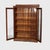 This antique Larkin Arts & Crafts oak two-door bookcase, dating to circa 1920, presents a classic example of early 20th-...
