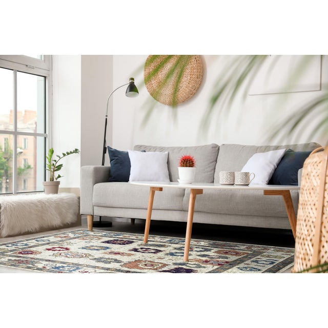 Sumptuous Fiona Ivory Hand Knotted Wool Rug, Country of Origin: India. This luxurious piece is defined by its plush wool...