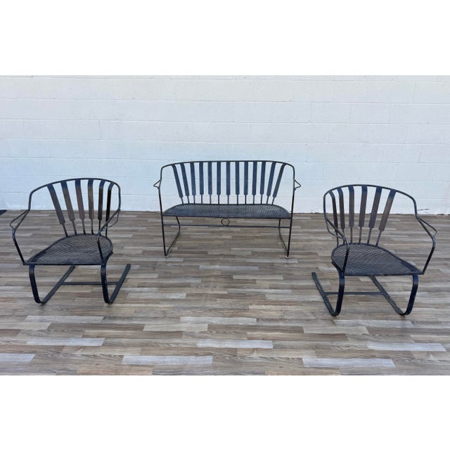 Create the perfect vintage outdoor retreat with this beautiful Mid-Century Modern wrought iron patio conversation set,...