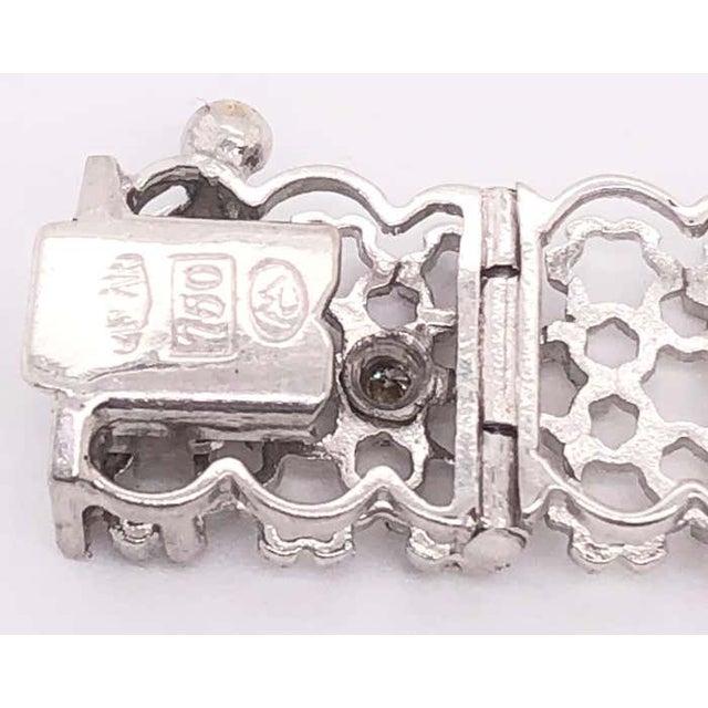 14 Karat White Gold 7.5 Inch Contemporary Bracelet with Round Diamonds. 0.60 diamond total weight. 24 grams total weight.