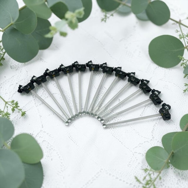 A set of 12 Cocktail swizzle sticks with decorative Scottie Terrier motifs. These swizzle sticks are used to stir mixed...