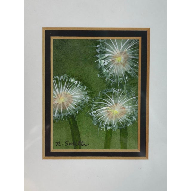 This original miniature watercolor painting captures delicate dandelion seed heads glowing against a deep green...