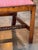 An 18th century English mahogany hall bench with a triple chair back, each back with an interlaced pierced splat ending in...