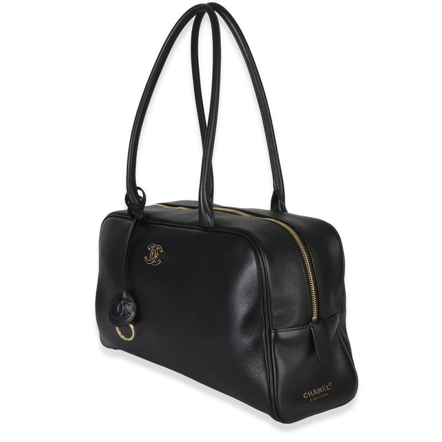 Item #: Z154478 Features Interior: One zip pocket Dimensions: 14 x 7.5 x 4.5 in Handbag Closure Type: Zip-Around Strap...