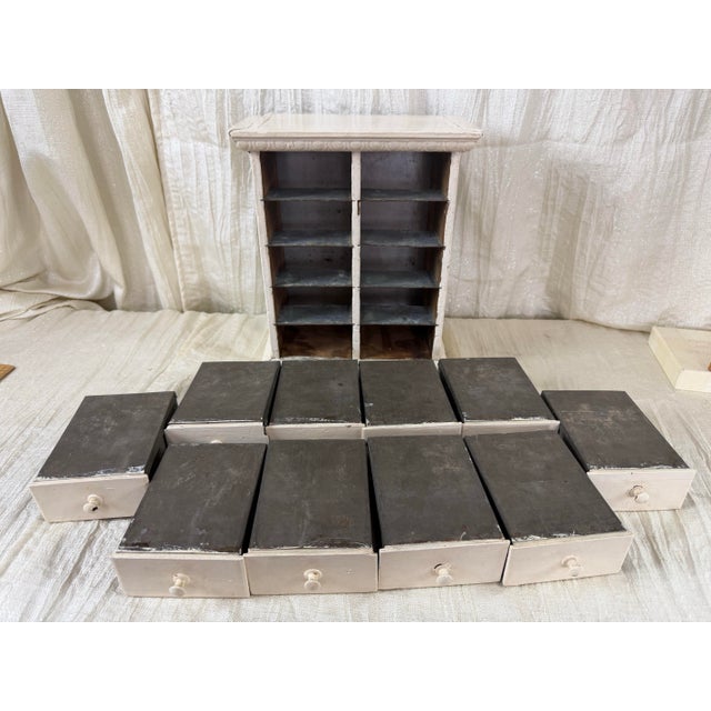A wonderfully diminutive antique spice cabinet combining vernacular American craftsmanship with unusually elaborate...