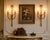 This elegant pair of late 20th-century French wall sconces reflects the refined symmetry and classical ornamentation of...