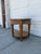 We have a beautiful vintage Louis XVI Revival side table for sale featuring ornate carved wood, an inset glass top, and...