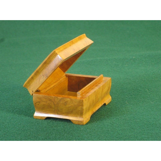 This exotic burlwood maple jewelry box organizer is handcrafted and designed for both men and women. The beige color and...