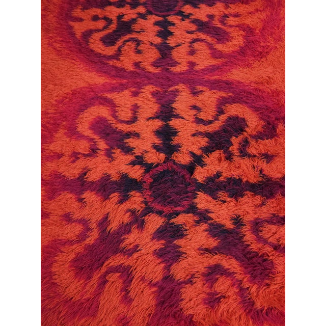 Mid-Century Modern Axminster Orange Flokati Rug in Wool, United Kingdom, 1970s, in Very Good conditions. Designed 1970 to...