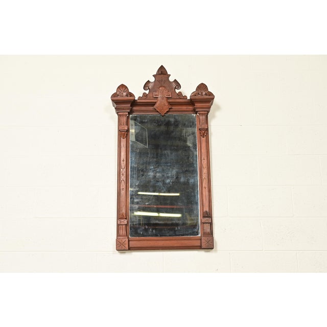 A gorgeous antique Victorian Eastlake period wall mirror In the manner of Herter Brothers USA, Circa 1880s Ornate carved...