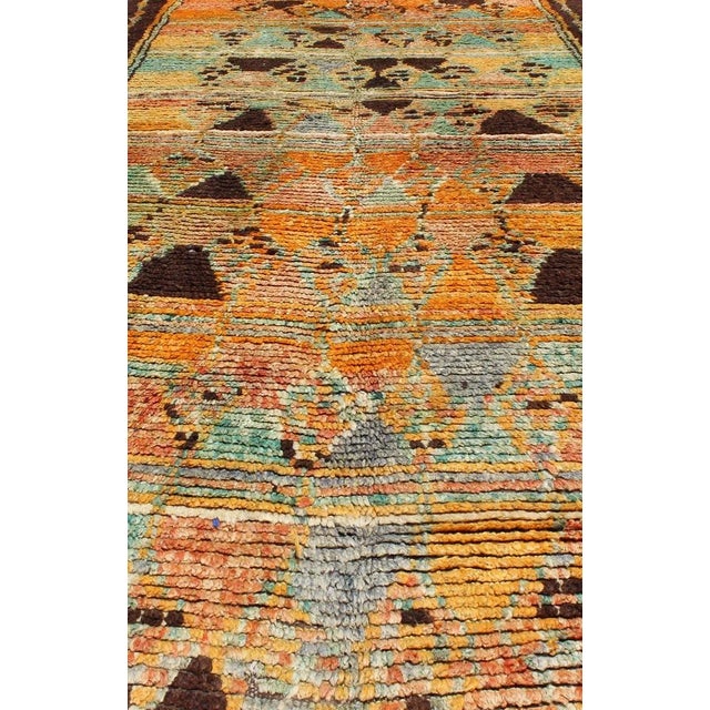 Long Vintage Moroccan Gallery Runner with Tribal Design in Orange, Brown, Blue and Green. Mid-20th Century, Keivan Woven...