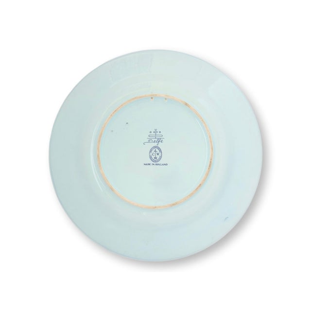 A handsome Delft Colonial Williamsburg Restoration plate made in Holland, faithfully reproducing an historic eighteenth...