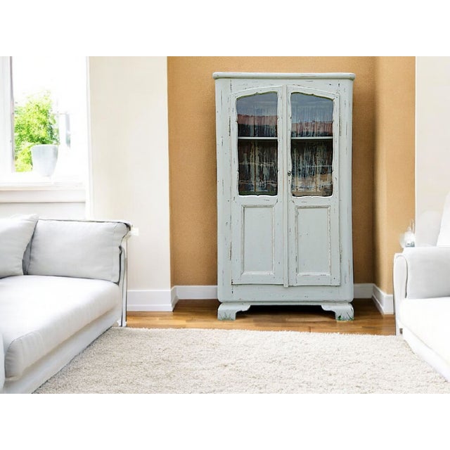 The antique "Elswyn" sideboard was likely made in Germany between 1900 and 1920 and combines traditional craftsmanship...