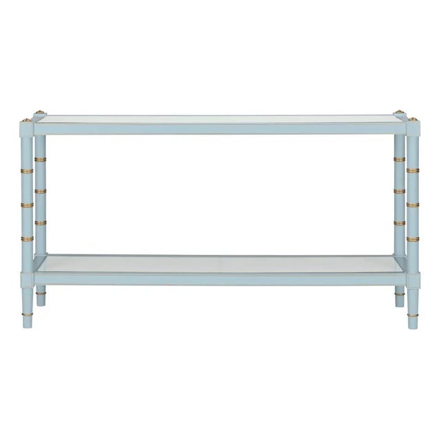 The Connor Console Table in blue is adorned with gold hand-painted detailing around the edge of the bamboo-inspired legs...