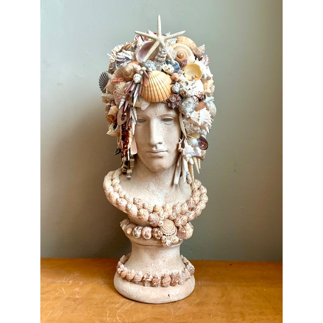 This exceptional vintage shell-encrusted bust sculpture masterfully combines classical form with coastal artistry,...