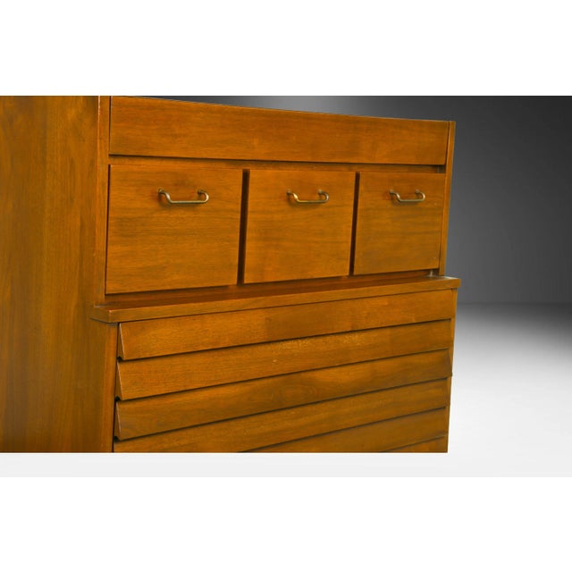This exceedingly well crafted American of Martinsville louvered slat front drawer highboy dresser was designed by Merton...