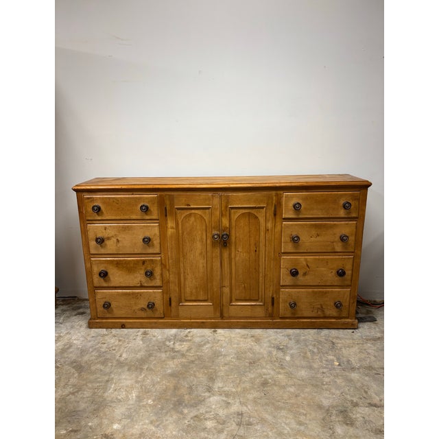 A splendid example of 19th century English country furniture, this pine sideboard dresser base charms with its stately...