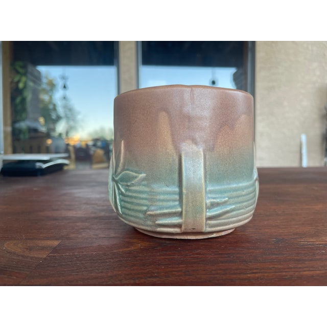 This rare vintage McCoy planter stands about 4 1/4" tall, 5 1/2" wide and 4 5/8" across edges of the opening. The piece is...
