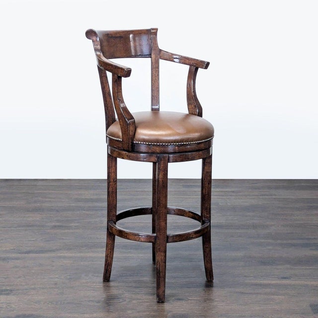 Wood chair with back, arms, and footrest upholstered in leather with nailhead trim. Brand: Alder & Co.. Dimensions (in):...