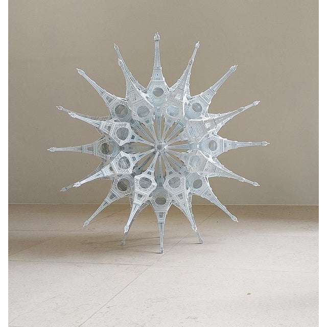 Constructed from 96 Eiffel-tower-models. It can be seen as a comment on mass-production, mass-tourism, national identity,...