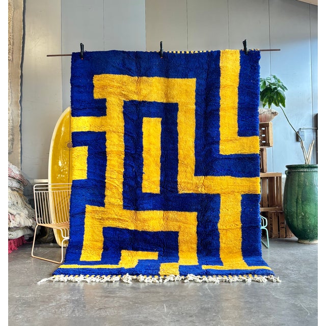 A vibrant Beni M'rirt rug from the Middle Atlas Mountains of Morocco, handknotted in thick wool by Berber artisans. The...