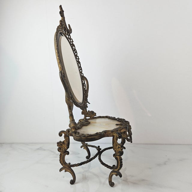 This elegant Rococo Revival tabletop vanity mirror displays exceptional 19th-century European craftsmanship. The finely...