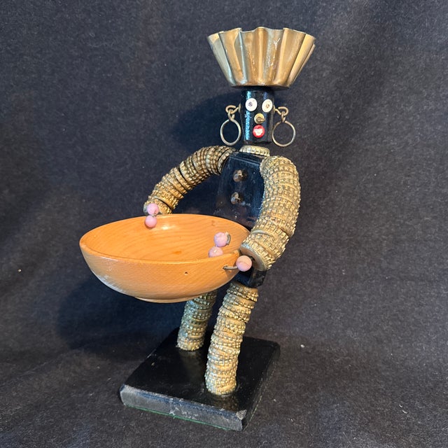 Mixed media folk art figure with maple serving bowl. Thumb tacks, baking dishes, bottle tops and wood and paint- were used...