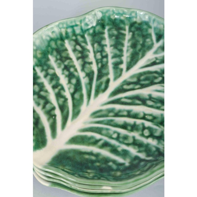 Secla, 5 plates, Portugal, 1960/70s Organically shaped faience plates in majolica, shaped like cabbage leaves, with a...