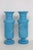 This gorgeous Pair of 2 Vases are made of glass. These lovely vases a present a gorgeous turquoise blue color throughout...