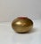 A very rare Egg shaped money bank (The Smile) in solid brass featuring a red removable money slot. Designed by the Danish...