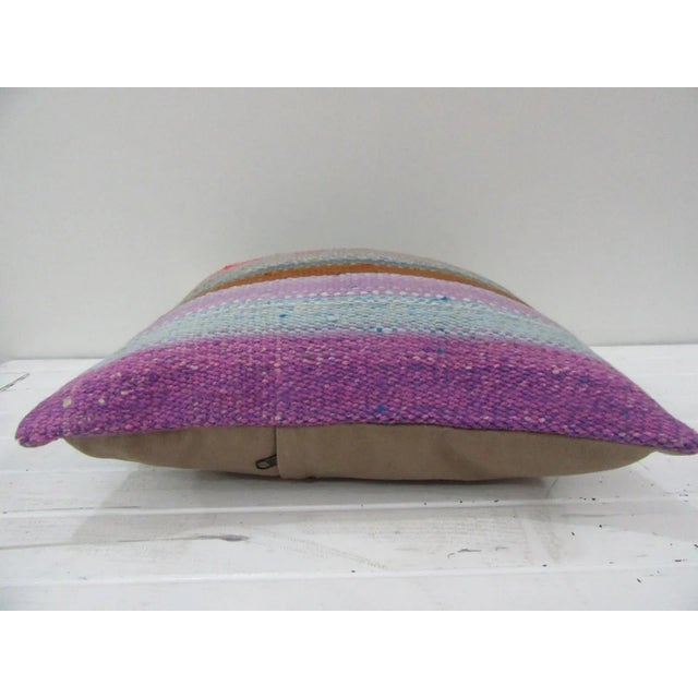 This is a pillow cover made from a vintage kilim rug. The piece was properly washed and ready to use. Pillow inserts not...