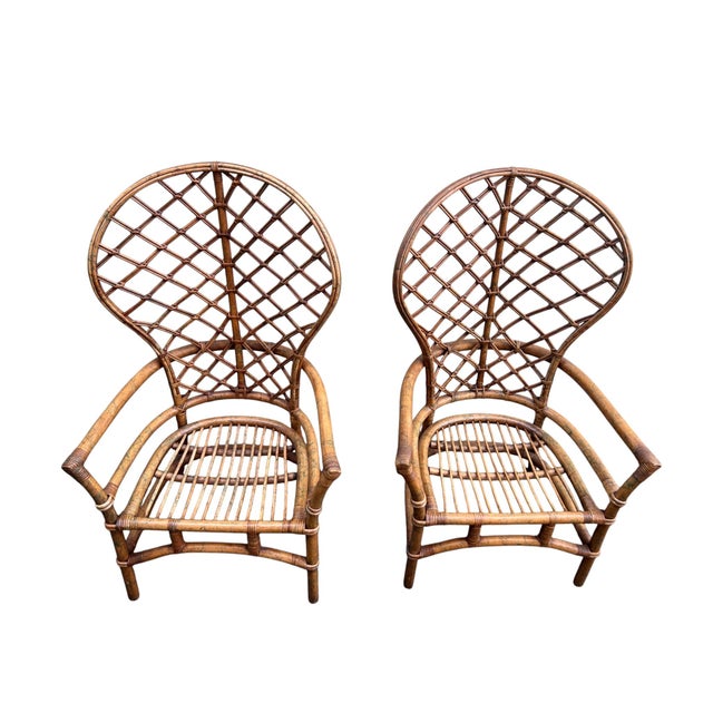 Stunning pair of vintage Mid-Century Ficks Reed bamboo and rattan peacock chairs. Woven stick wicker high balloon backs....
