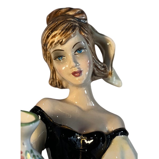 this striking 16-inch-tall mid-century Italian porcelain figurine depicts a vibrant young woman, styled as a traditional...