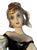 this striking 16-inch-tall mid-century Italian porcelain figurine depicts a vibrant young woman, styled as a traditional...