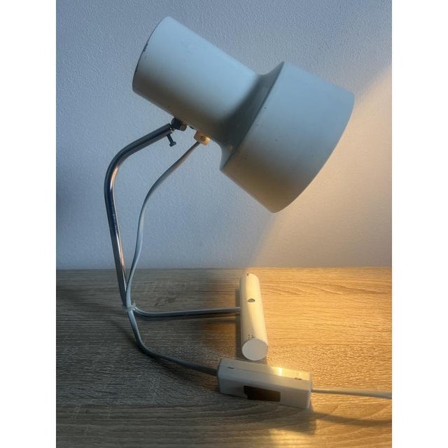 White metal lamp, edited by Napako, 1970s. This piece is designed in the style of the selected designer and/or...