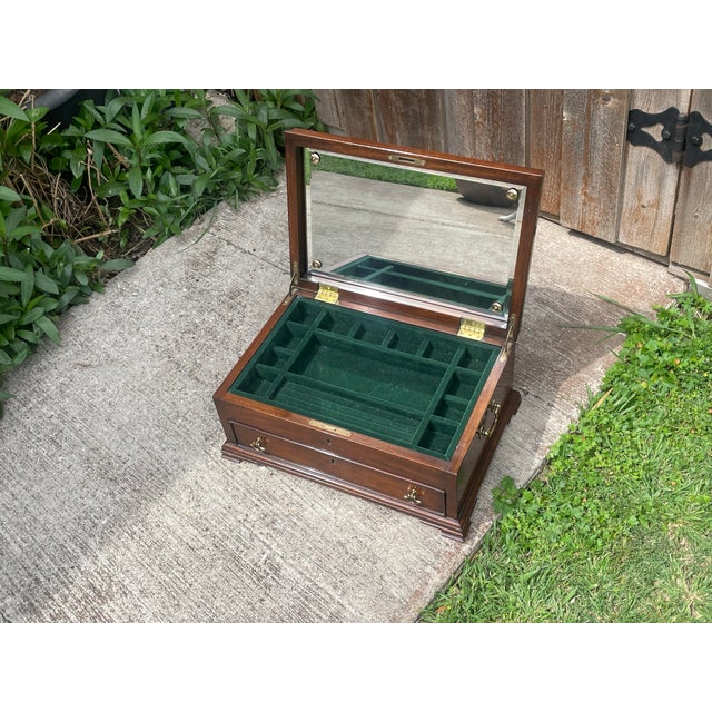 Rectangular top with ogee shape. Hand fitted bead mold on bottom edge of lid below frieze. Solid wood top rail with lock...